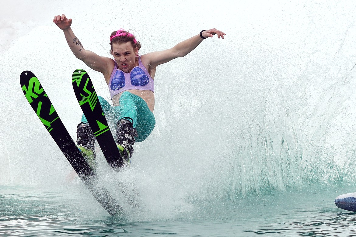 Corbin Richards, dressed as a mermaid, was able to hold on and make it the whole way across the pond on this run during the 2019 Whitefish Pond Skim at Whitefish Mountain Resort on Saturday. (Casey Kreider/Daily Inter Lake)