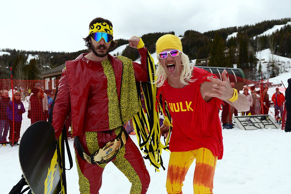 Jacob Prestegaar, left, dressed as former WWE wrestler Macho Man Randy Savage, celebrates with a competitor dressed as former wrestler Hulk Hogan during the 2019 Whitefish Pond Skim at Whitefish Mountain Resort on Saturday. (Casey Kreider/Daily Inter Lake)