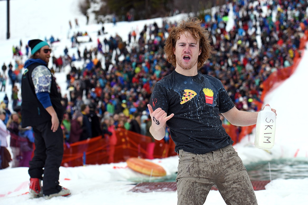 Shane Marcial celebrates after a successful trip across the pond during the 2019 Whitefish Pond Skim at Whitefish Mountain Resort on Saturday. (Casey Kreider/Daily Inter Lake)