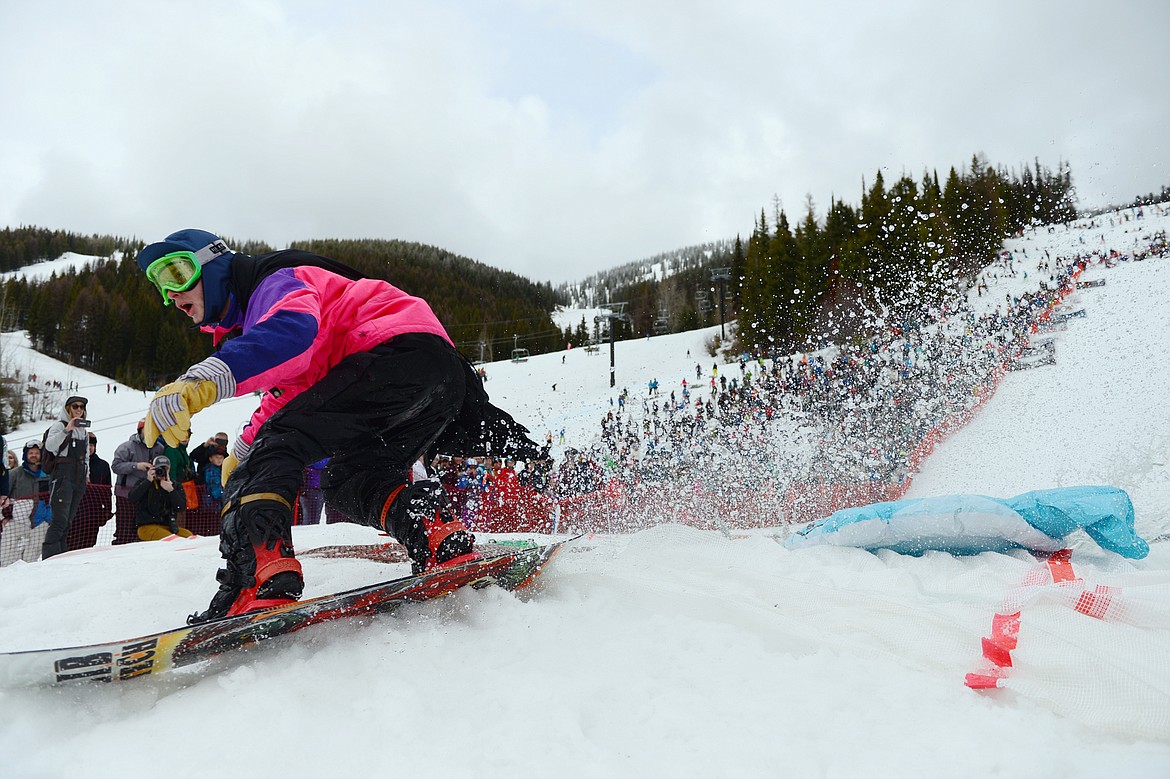 Anthony DeMasi successfully skims across the pool during the 2019 Whitefish Pond Skim at Whitefish Mountain Resort on Saturday. (Casey Kreider/Daily Inter Lake)