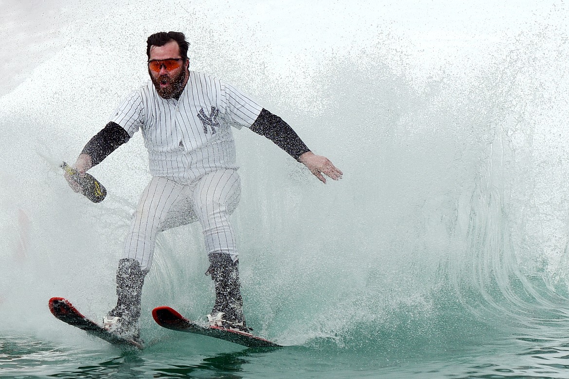 Billy Marcial, wearing the New York Yankees Mickey Mantle jersey worn by his late father Jack &quot;Rad Jack&quot; Marcial, skims across the pond during the 2019 Whitefish Pond Skim at Whitefish Mountain Resort on Saturday. (Casey Kreider/Daily Inter Lake)