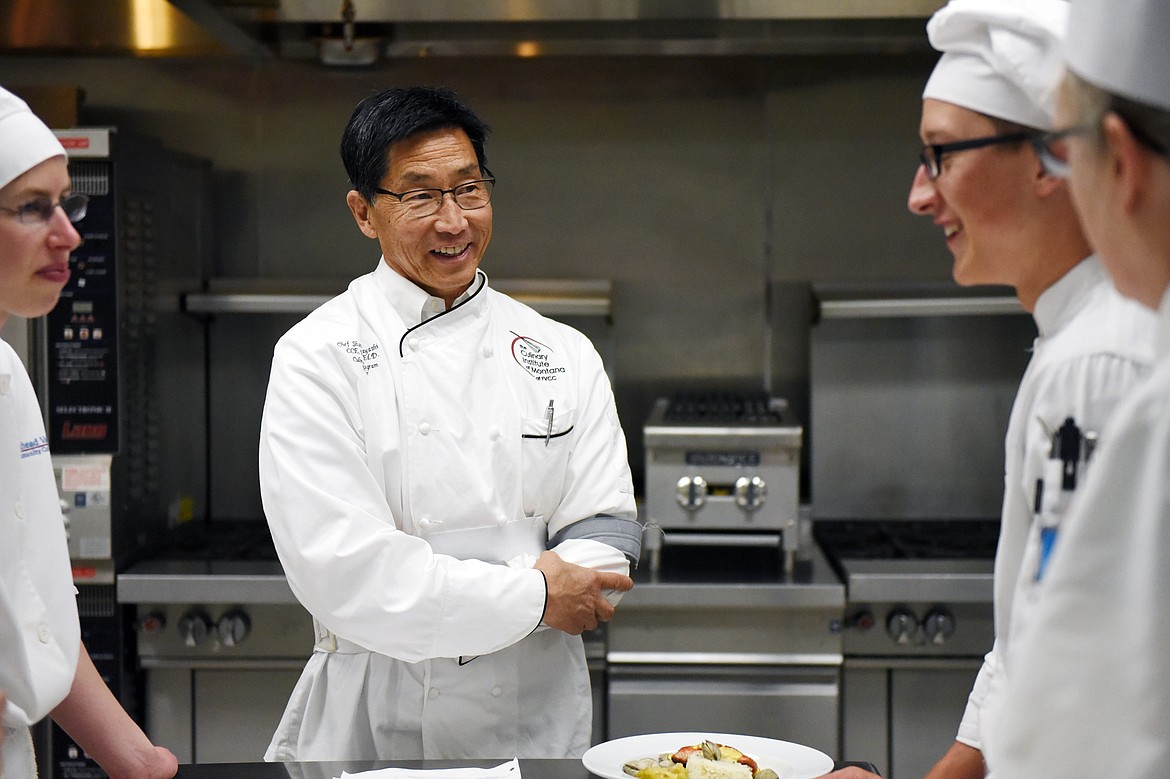 Culinary program director Shannon Hayashi, center, speaks with students after they had finished preparing their dishes inside the kitchen at the Culinary Institute of Montana at Flathead Valley Community College on Wednesday, April 3. (Casey Kreider/Daily Inter Lake)