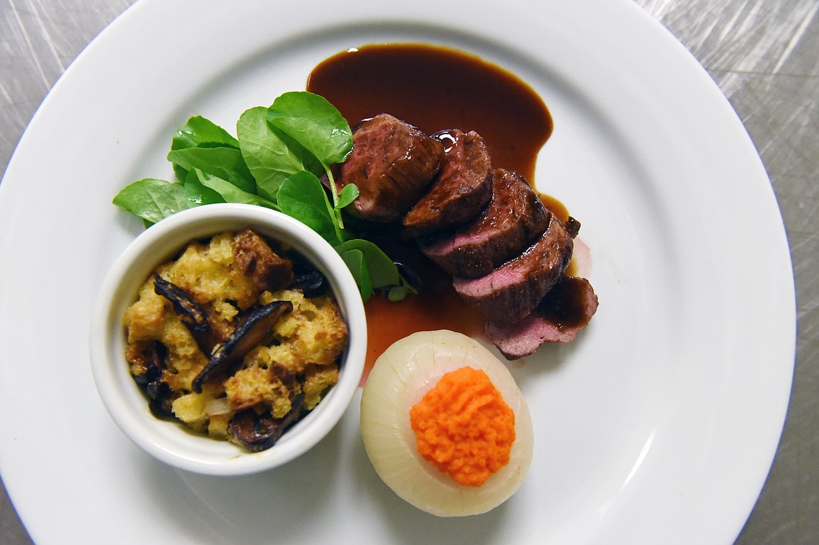 Roasted Rack of Northwest Lamb with Porcini bread pudding and Walla Walla onion cups prepared by the students at the Culinary Institute of Montana at Flathead Valley Community College on Wednesday, April 3. (Casey Kreider/Daily Inter Lake)