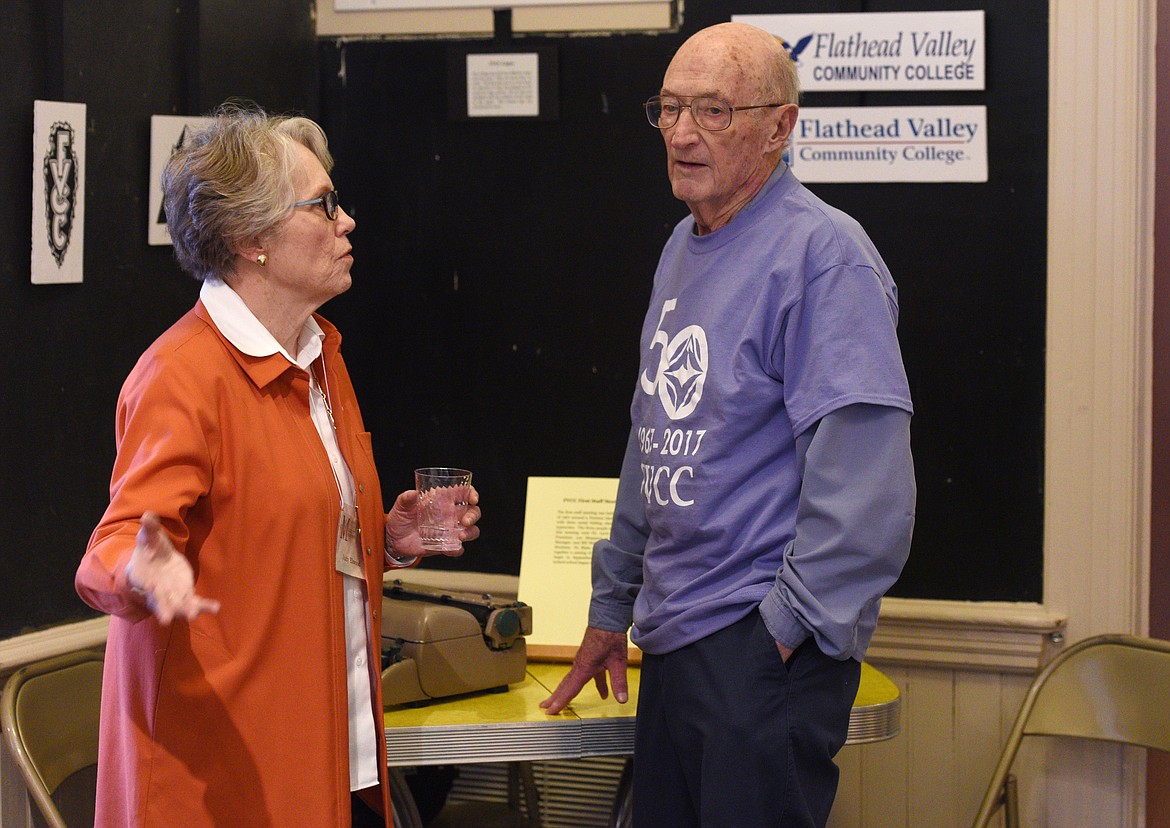 Bill McClaren speaks with Judy Elwood in front of a Formica table like the one that McClaren had the first Flathead Valley Community College staff meeting in the spring of 1967. The table was part of exhibit to commemorate the college&#146;s 50th anniversary at the Museum at Central School. (Aaric Bryan/Daily Inter Lake)