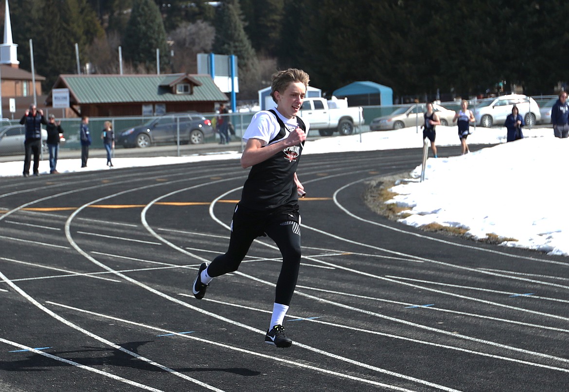 Travis Matthews runs the last leg of the 4x200 relay at the Bonners Ferry Invitational in 2021. The 4x200 meter relay team finished in eighth place during the 2022 Class 3A Idaho state track meet.