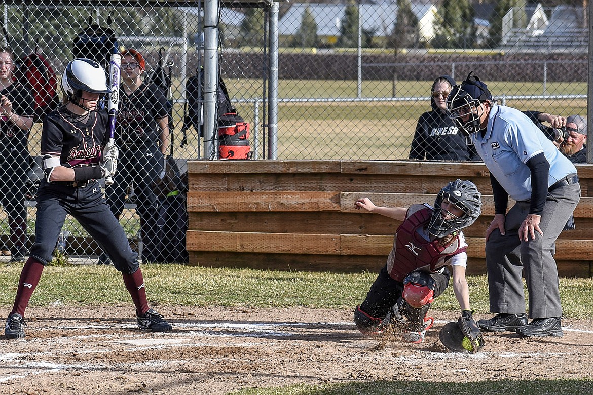 Troy senior Kaylee Tunison reaches for the catch, bottom of the second, at home against Florence Thursday. (Ben Kibbey/The Western News)