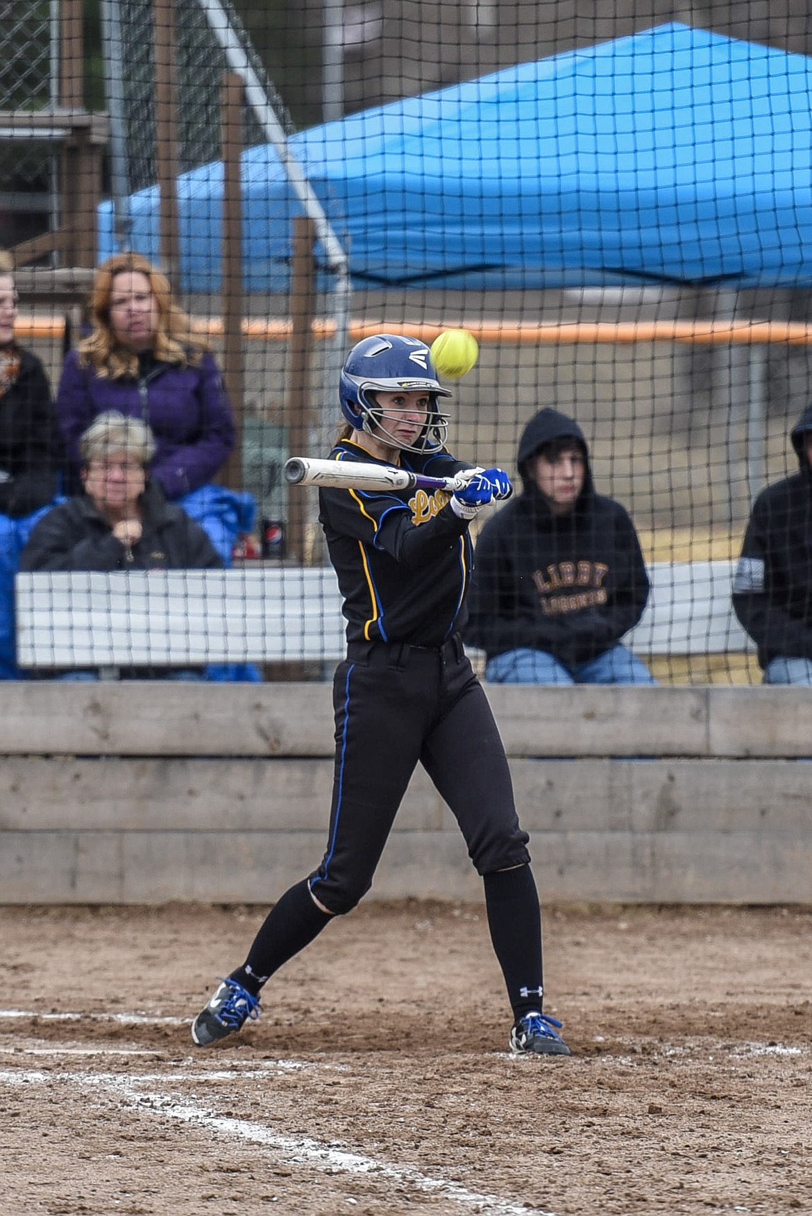 Libby senior Samantha Miller hits a high fly ball toward center field, almost reaching the fence for a base hit against Columbia Falls, bottom of the sixth, Saturday at Remp Field. (Ben Kibbey/The Western News)