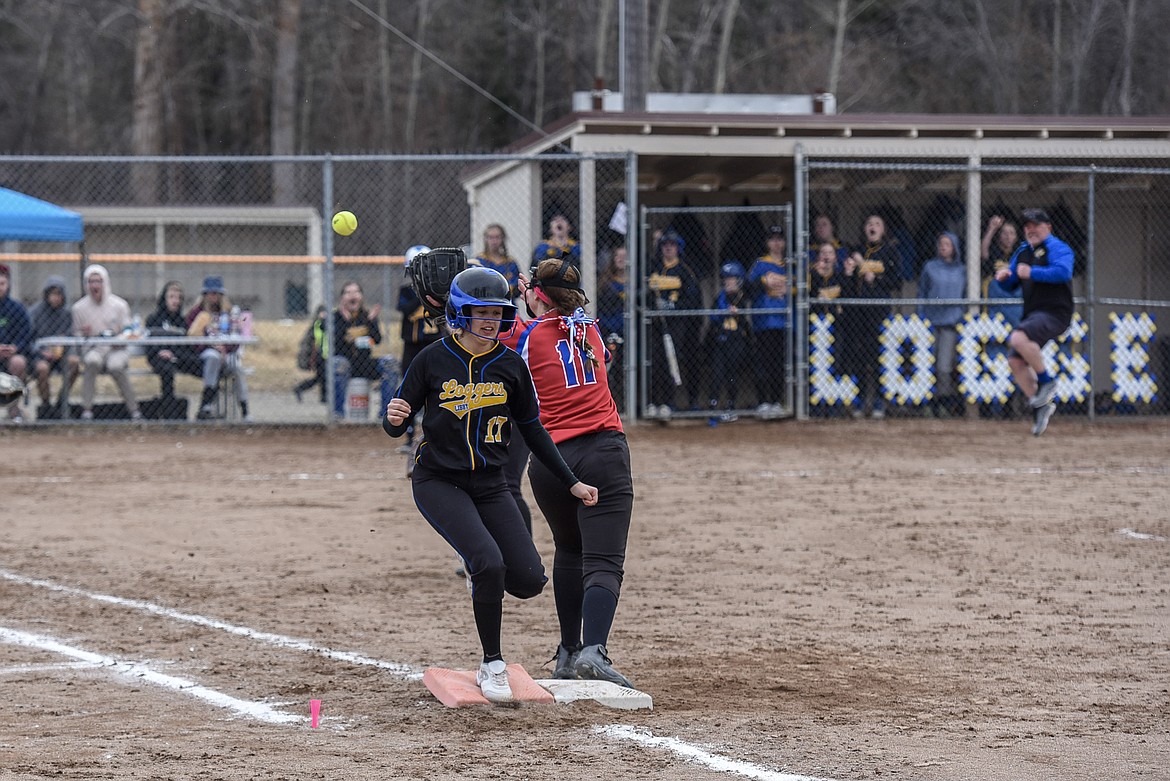 Libby junior Keira Ward is safe at first on a bunt that sent sophomore Bethany Thomas home to score the final run for the Loggers, bottom of the fifth, Saturday at Remp Field. (Ben Kibbey/The Western News)