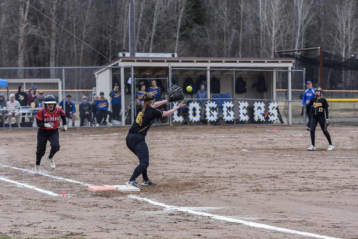 Columbia Falls&#146; Alyssa Blankenship comes up short as Libby junior first baseman McKenzie Proffitt gets the catch, after Blankenship grounded out to Libby junior pitcher Keira Ward, final out, top of the third, Saturday at Remp Field. (Ben Kibbey/The Western News)