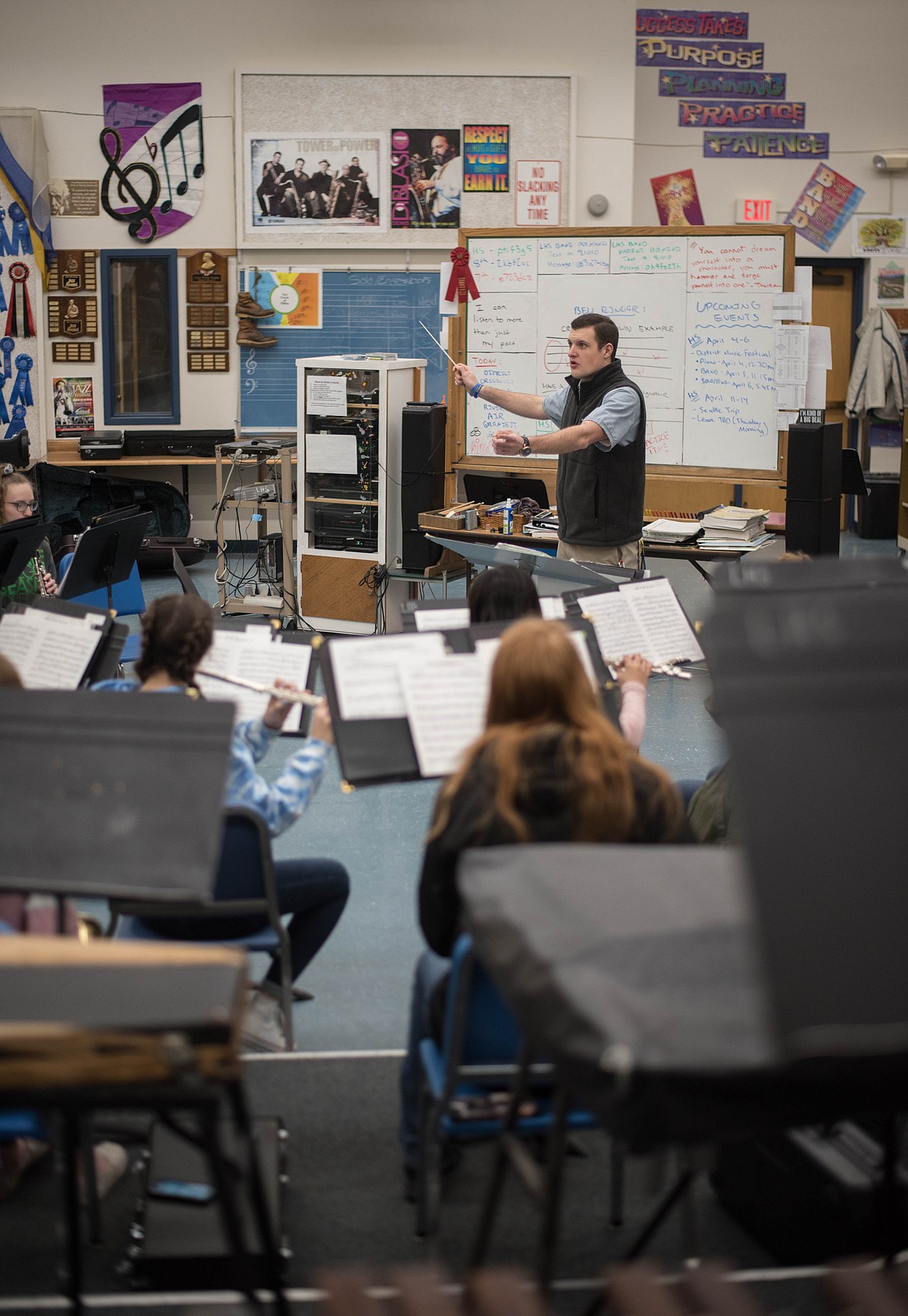 Matthew Krantz, band director for the school district, helps guide high school students as they learn to play music from The Greatest Showman, Wednesday in Libby.