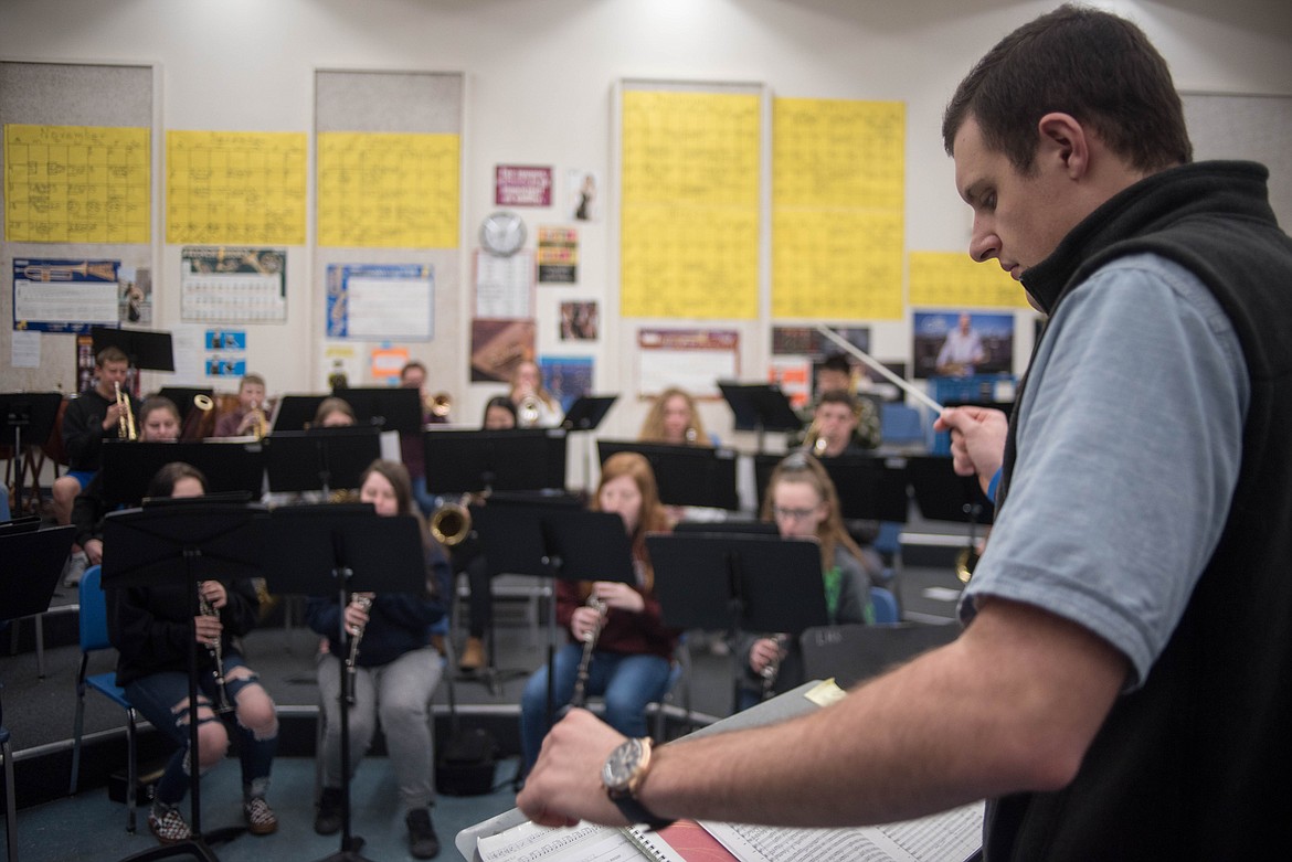 Matthew Krantz, band director for Libby Public Schools, helps guide high school students as they learn to play music from The Greatest Showman, Wednesday in Libby. (Luke Hollister/The Western News)