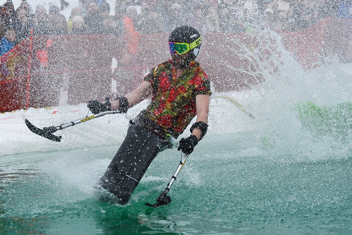 A sit-skier flies across the water during the 2019 Pond Skim on Saturday at Whitefish Mountain Resort. (Daniel McKay/Whitefish Pilot)