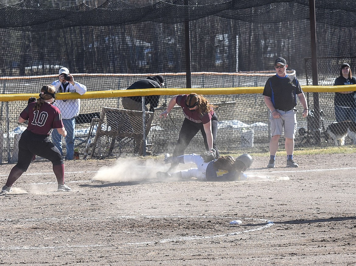 Troy&#146;s Montana Rice gets the tag on Libby&#146;s Bethany Thomas to end the second inning, Tuesday at Remp Field in Libby. (Ben Kibbey/The Western News)