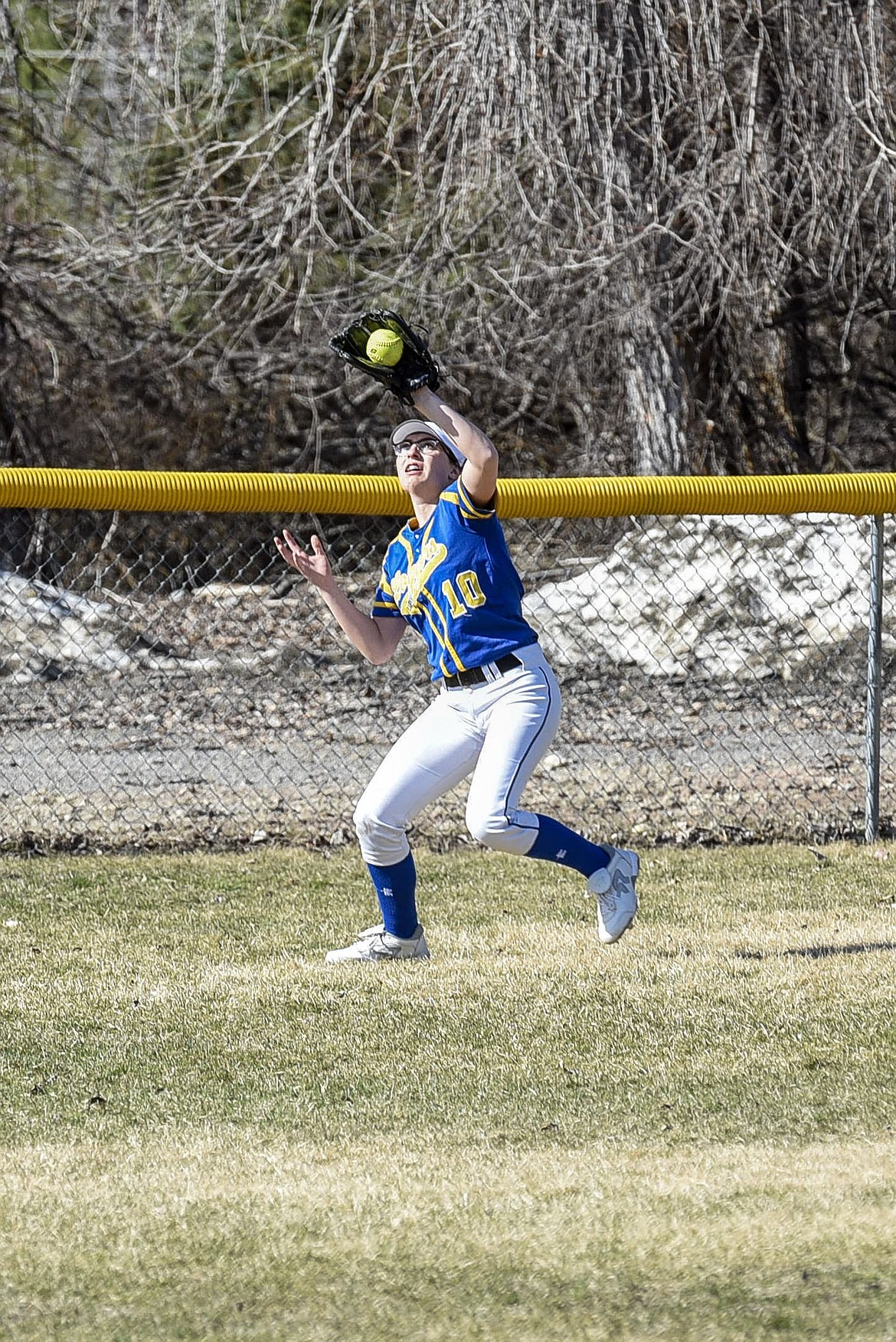 Libby right fielder Kayley Svendsbye catches the final out, top of the first, Tuesday at Remp Field in Libby. (Ben Kibbey/The Western News)