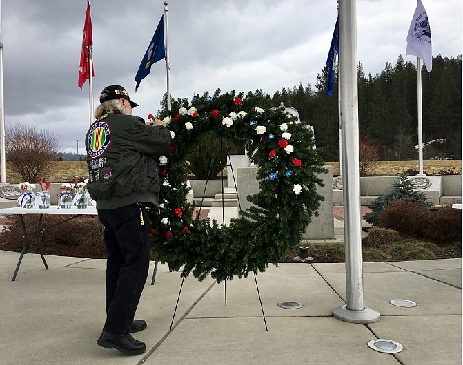 Courtesy photo
A veteran places a carnation on a wreath during the National Vietnam Veterans Day celebration Friday in Coeur d&#146;Alene.
