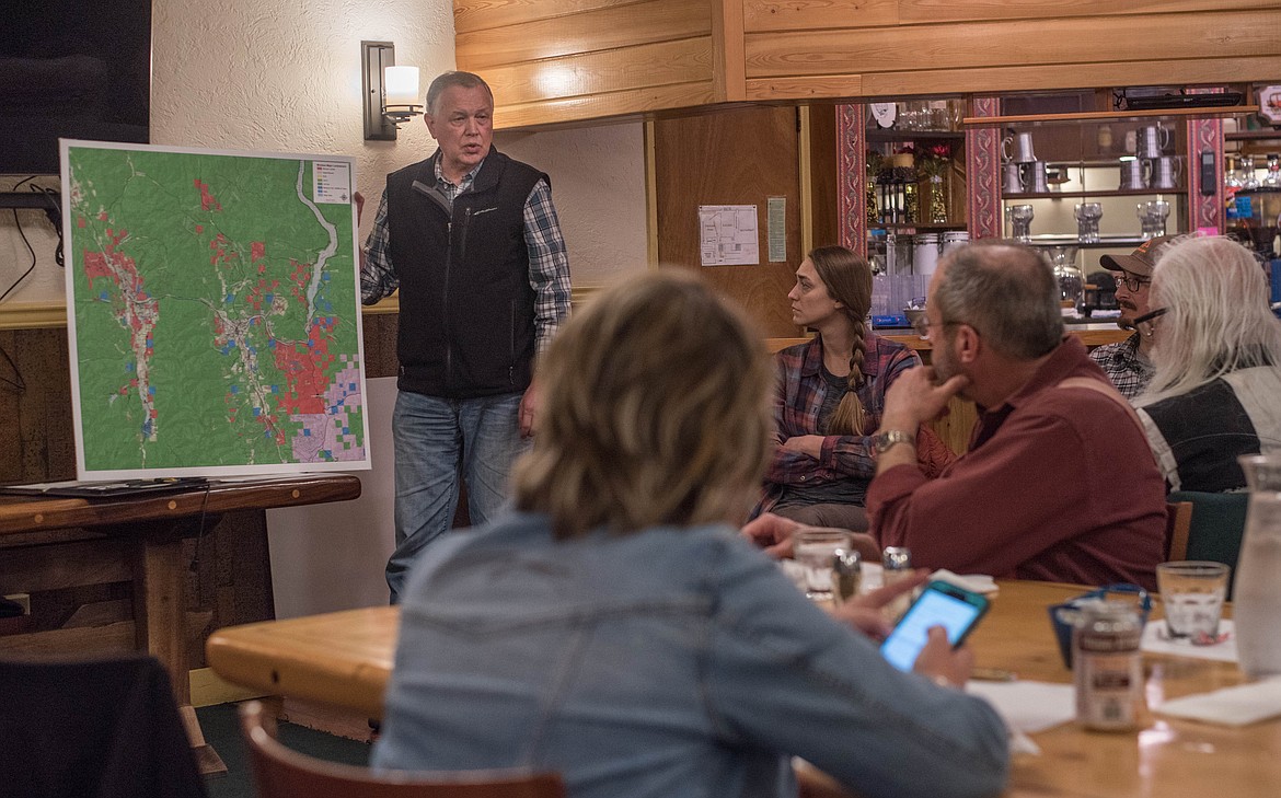 Barry Dexter, director of inland resources at Stimson Lumber Company, shares a map showing what land in Lincoln County the company owns, Thursday at a meeting with the Society of American Foresters in Libby. (Luke Hollister/The Western News)