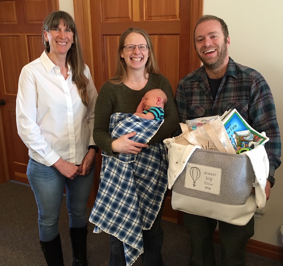 Courtesy photo
Congratulations to the Ross family on welcoming baby Benjamin John Anthony as Boundary County Farm Bureau&#146;s Ag Baby. Women&#146;s Committee Chair, Kristy Kellogg, presented a basket full of goodies, including a quilted farm book made by Virginia Cowley, to the family. Pictured here are Kristy Kellogg, Stephanie Ross, Zach Ross and baby Benjamin. Also welcoming Benjamin are three older sisters. Congrats again!