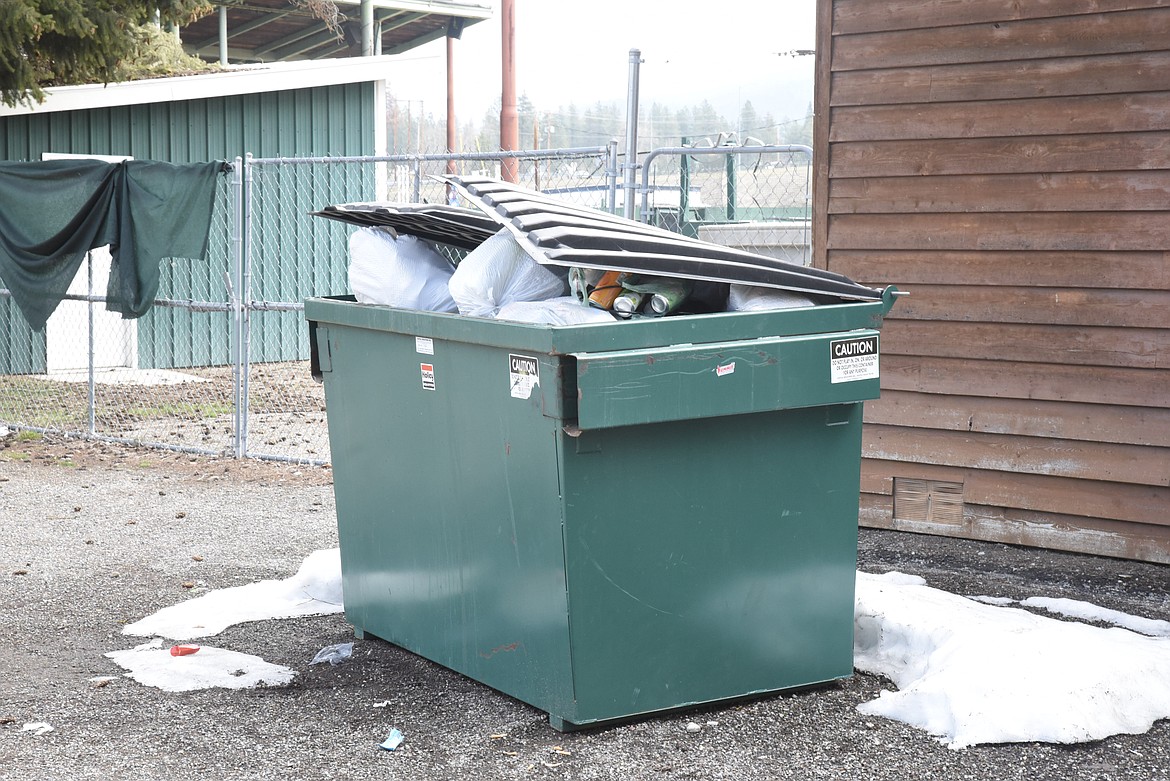 The dumpster was full of trash from Sunday&#146;s cleanup behind the concession stand at Lee Gehring Memorial Field Monday. (Ben Kibbey/The Western News)