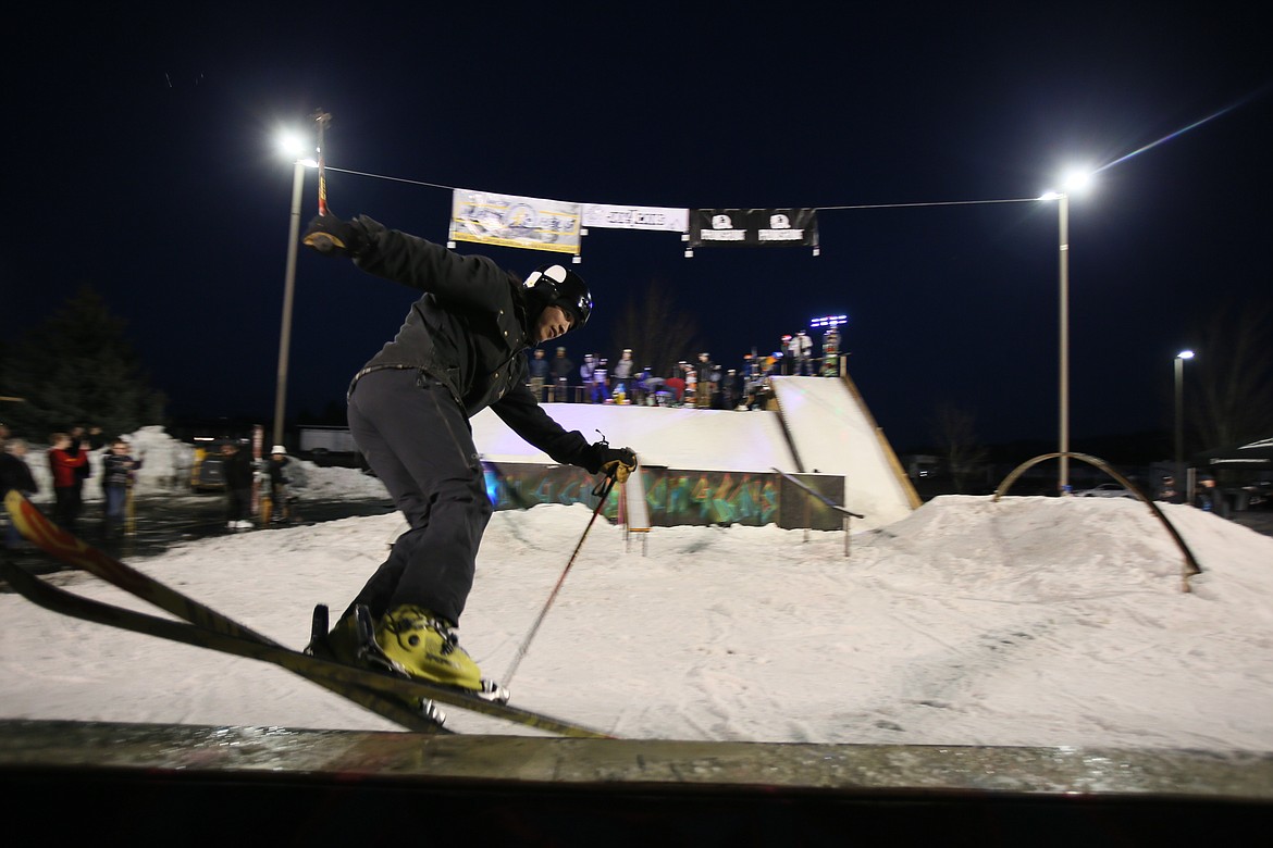 DEVIN WEEKS/Press
Tyler Tram slides on a rail Saturday night during the Jam 4 Cans Charity Rail Jam at Summit Northwest Ministries in Post Falls. The annual event is held to collect food for local food banks and bring the excitement of the slopes into town for all to enjoy.