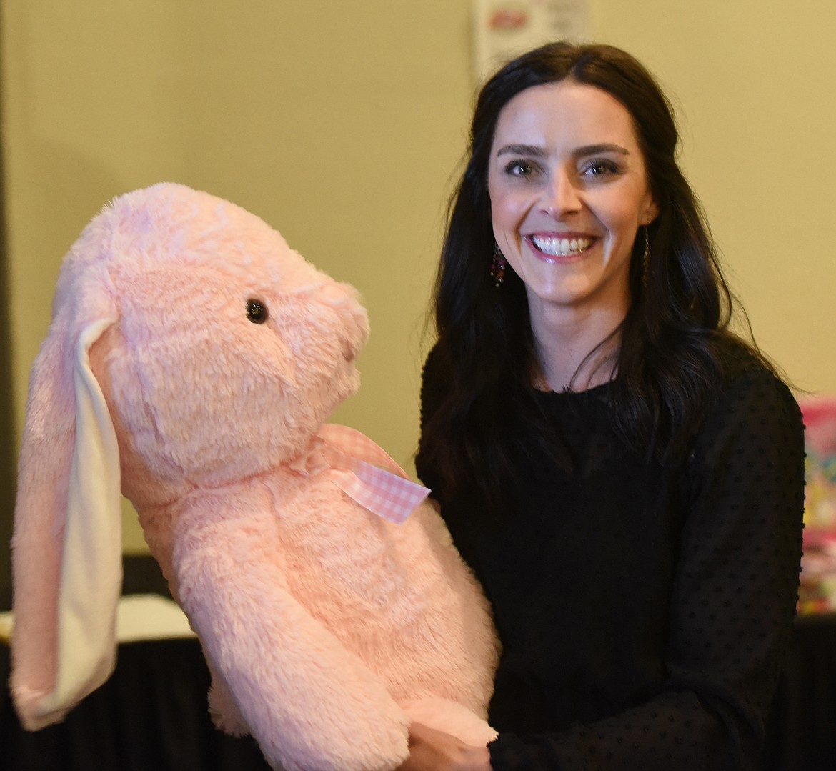 ROXANNE DUCKWORTH of Polson won a game of Bingo and chose a large stuffed bunny from the prize table.