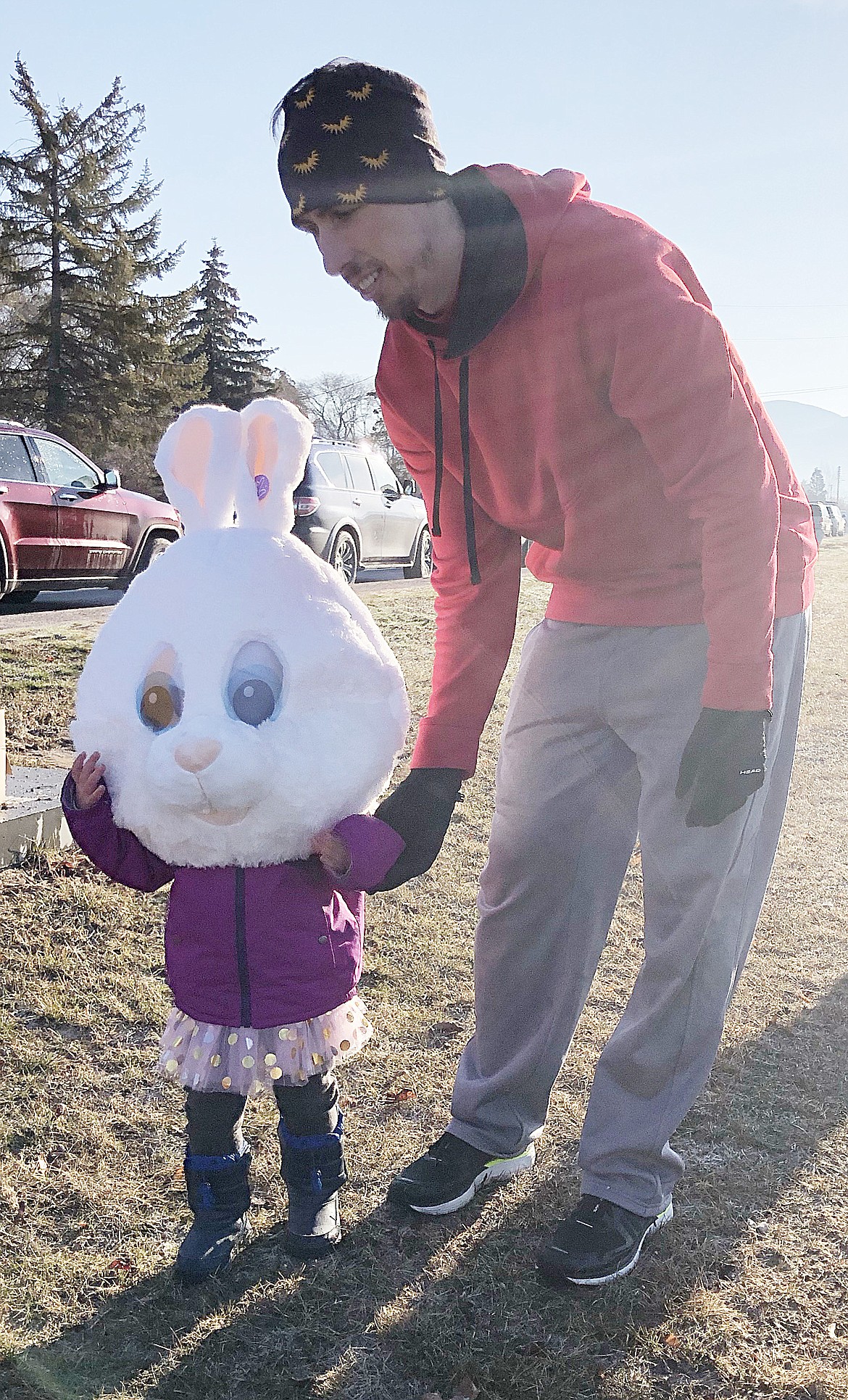 QUENTIN BATEMAN helps his daughter Brinley walk part of the March Meltdown 5K course to search for Easter eggs.