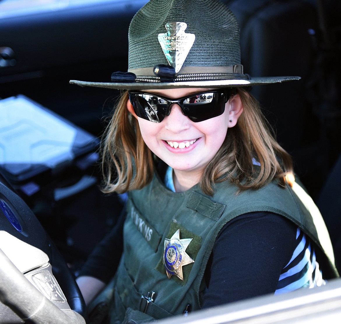 THE BIRTHDAY wish of 12-year-old Charlotte Kinnamon came true when she was the guest at a surprise party last Saturday, March 30. The event was the First Responders Appreciation Lunch at the Lake County Search and Rescue building on Main Street in Polson. Charlotte even got to wear Montana Highway Patrol Trooper James Hawkins&#146; duty vest and hat while sitting in a MHP car.