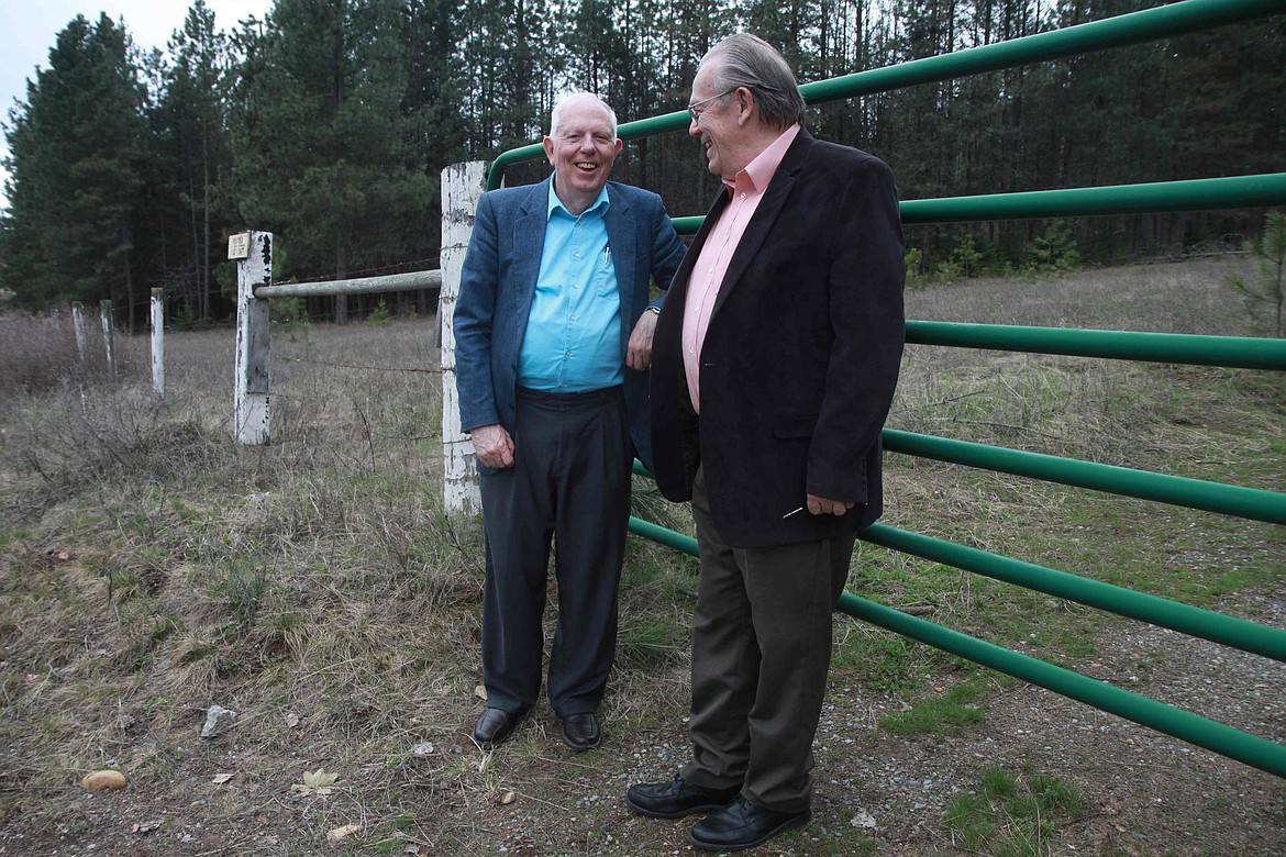 RALPH BARTHOLDT/Press
Tony Stewart, left, and Norm Gissel stand near the gate to the Hayden property that was once an Aryan Nations compound. Stewart, one of the founding members of the Kootenai County Task Force on Human Relations, and Gissel, an attorney whose work helped win a $6.3 million settlement that bankrupted the Aryan Nations, continue their human rights work today, nearly 20 years after the suit ended and the Aryans were trespassed from the property.