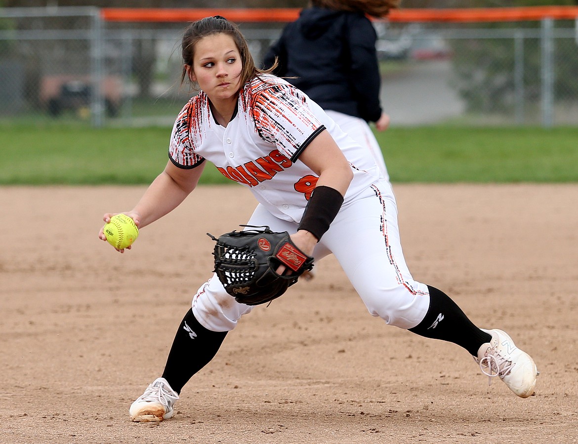 Brooke Collins of Post Falls fields a ground ball and throws to first base for the out in a game against Lake City on Tuesday. (LOREN BENOIT/Press)
