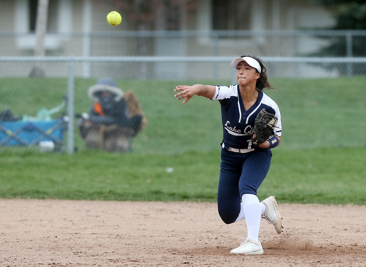 Lake City shortstop Ashlynn Allen fields the ball at short and throws to first for the out in a game against Post Falls on Tuesday. (LOREN BENOIT/Press)