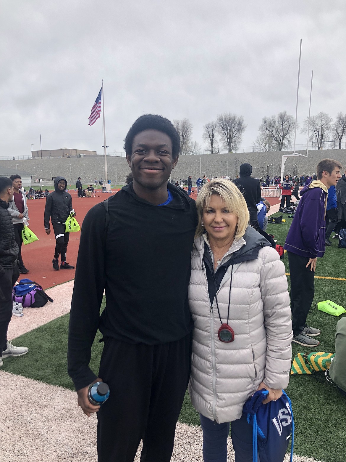 Courtesy photo
Coeur d&#146;Alene High senior Nate Burch and assistant coach Linda Lanker after Burch won the 110-meter hurdles at the Pasco Invitational for the second straight year on Saturday. Burch will continue his track and field career at the Community Colleges of Spokane next year, where Lanker is an assistant coach.