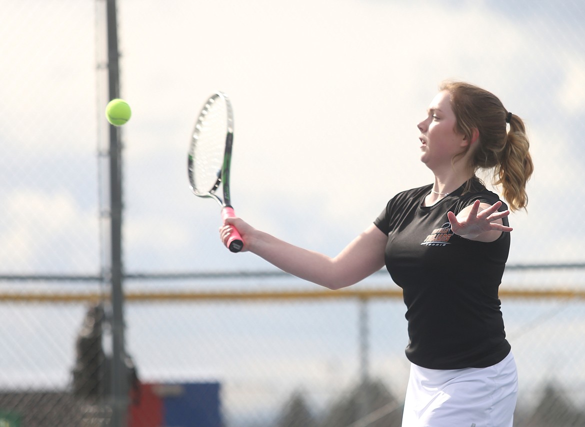 Molly Barkley of Post Falls High hits a volley near the net in the No. 1 girls doubles match Thursday.