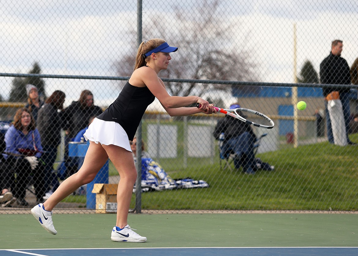 Coeur d&#146;Alene&#146;s Kim Gunnerson hits a volley in the No. 1 girls doubles match with Post Falls.