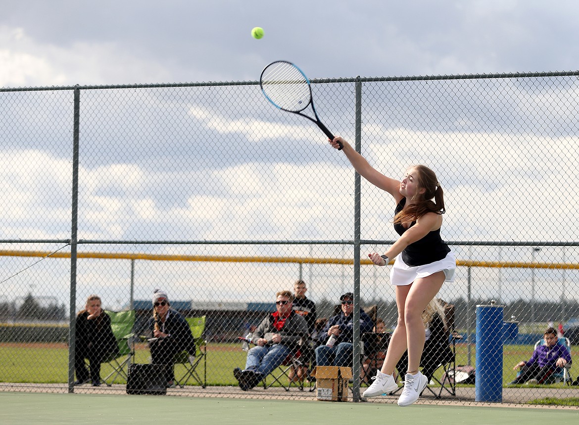 Coeur d&#146;Alene&#146;s Maggie Bloom hits a serve in the No. 1 girls doubles match against Post Falls on Thursday.