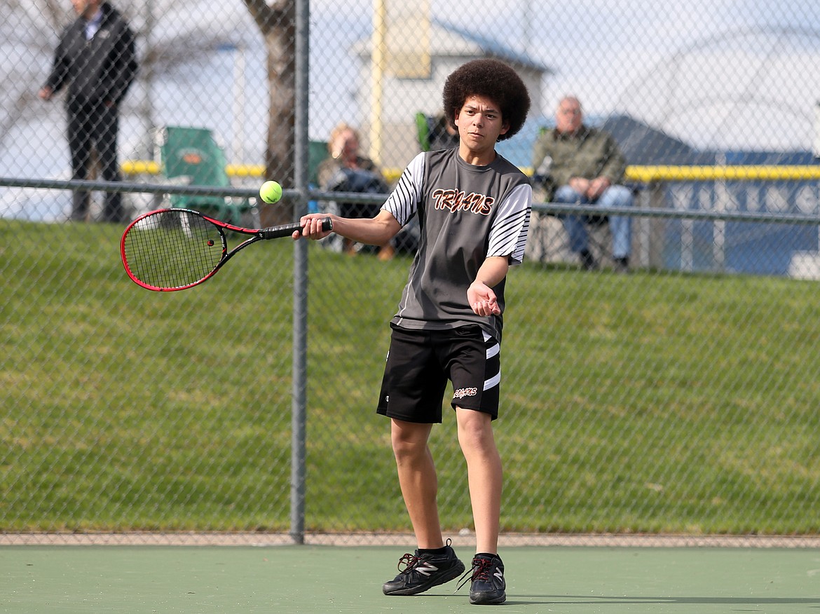 Malakai Verduzco of Post Falls hits a return to Coeur d&#146;Alene&#146;s Bayley Throm.