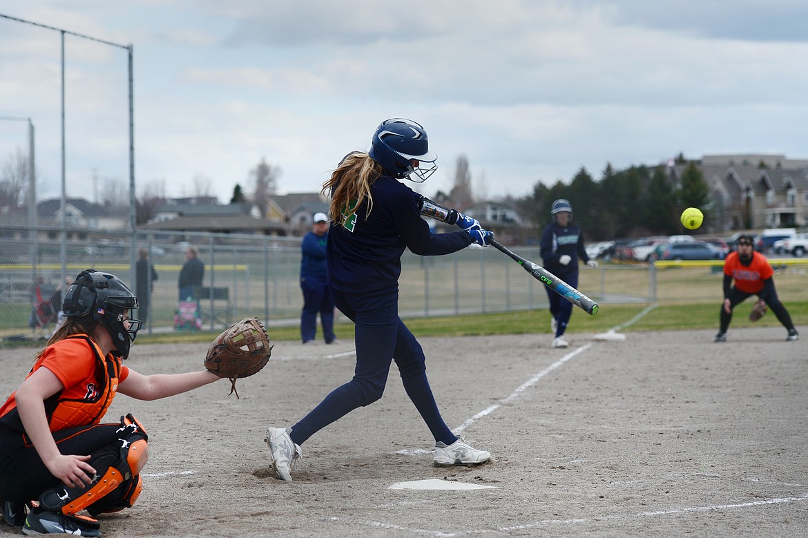 Glacier's Sophie Smith rips an RBI single in the second game of a doubleheader against Flathead at Kidsports Complex on Tuesday. (Casey Kreider/Daily Inter Lake)