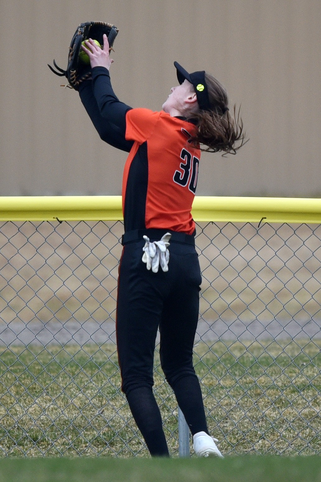 Flathead centerfielder Macy Craver catches a deep fly ball over her shoulder against Glacier at Kidsports Complex on Tuesday. (Casey Kreider/Daily Inter Lake)