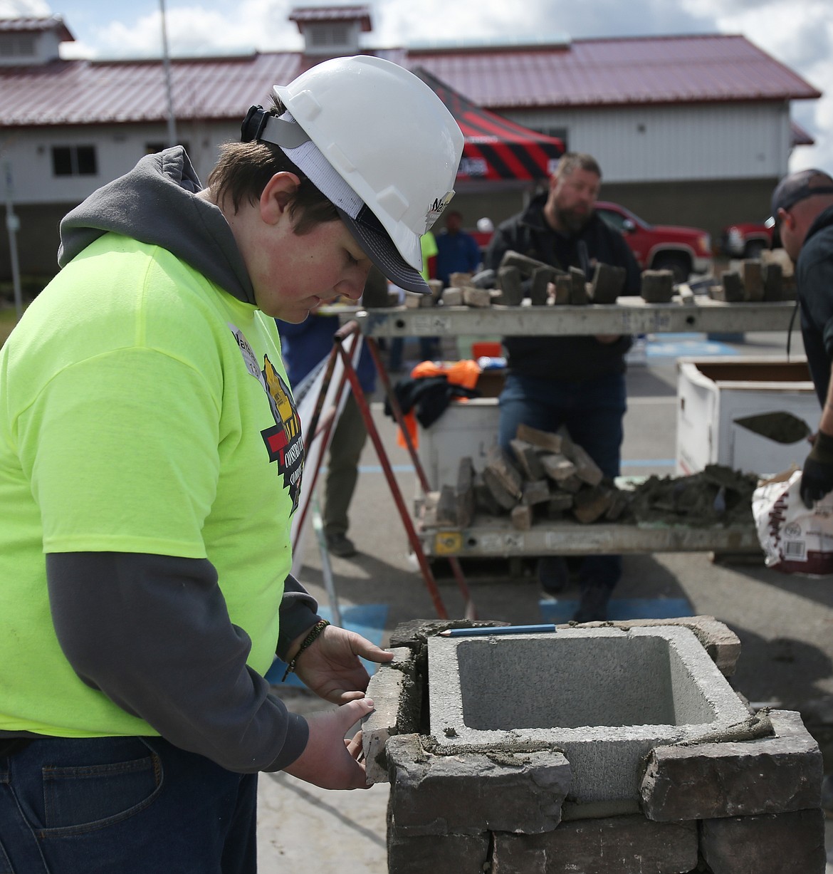 Lake City High School sophomore Nathan Briggs makes a chimney during the Construction Combine event Thursday at Kootenai Technical Education Campus.