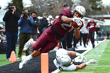 Montana Grizzlies running back Marcus Knight dives for the end zone on a long run from scrimmage during the Spring Game at Legends Stadium in Kalispell on Saturday. Knight was ruled out of bounds just short of the end zone. (Casey Kreider/Daily Inter Lake)
