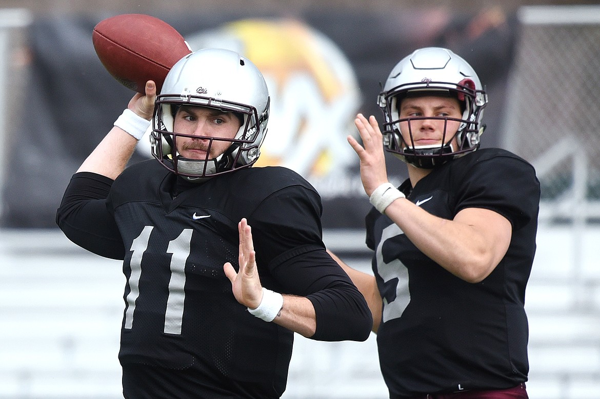 Montana Grizzlies quarterbacks Dalton Sneed, left, and Garrett Graves warm up before the Spring Game at Legends Stadium in Kalispell on Saturday. (Casey Kreider/Daily Inter Lake)