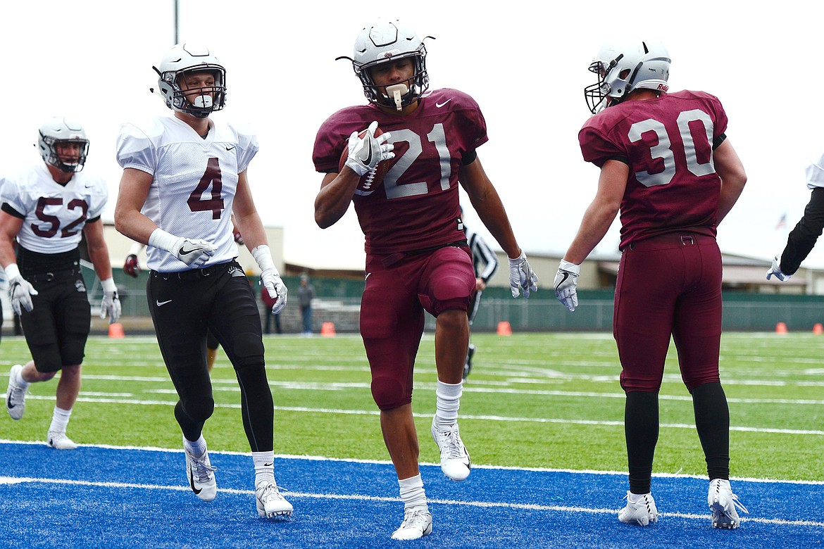 Montana Grizzlies running back Marcus Knight (21) crosses the end zone on a 6-yard touchdown run during the Spring Game at Legends Stadium in Kalispell on Saturday. (Casey Kreider/Daily Inter Lake)