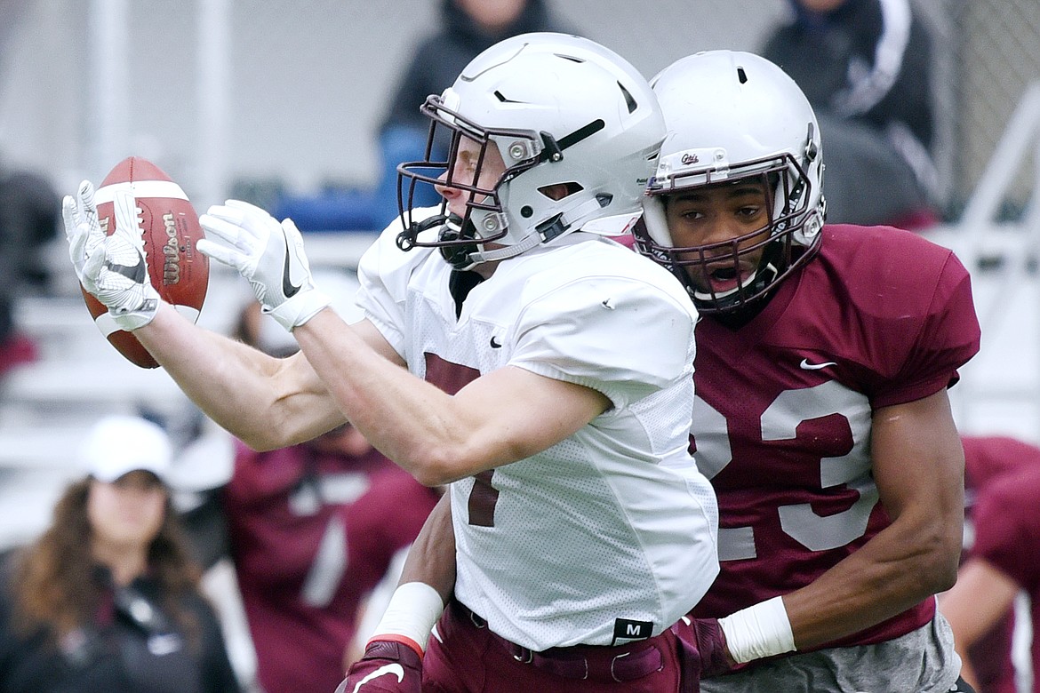 Montana Grizzlies wide receiver Gabe Susler (7) can't hang on to a pass as he's hit by cornerback Josh Egbo (23) during the Spring Game at Legends Stadium in Kalispell on Saturday. (Casey Kreider/Daily Inter Lake)