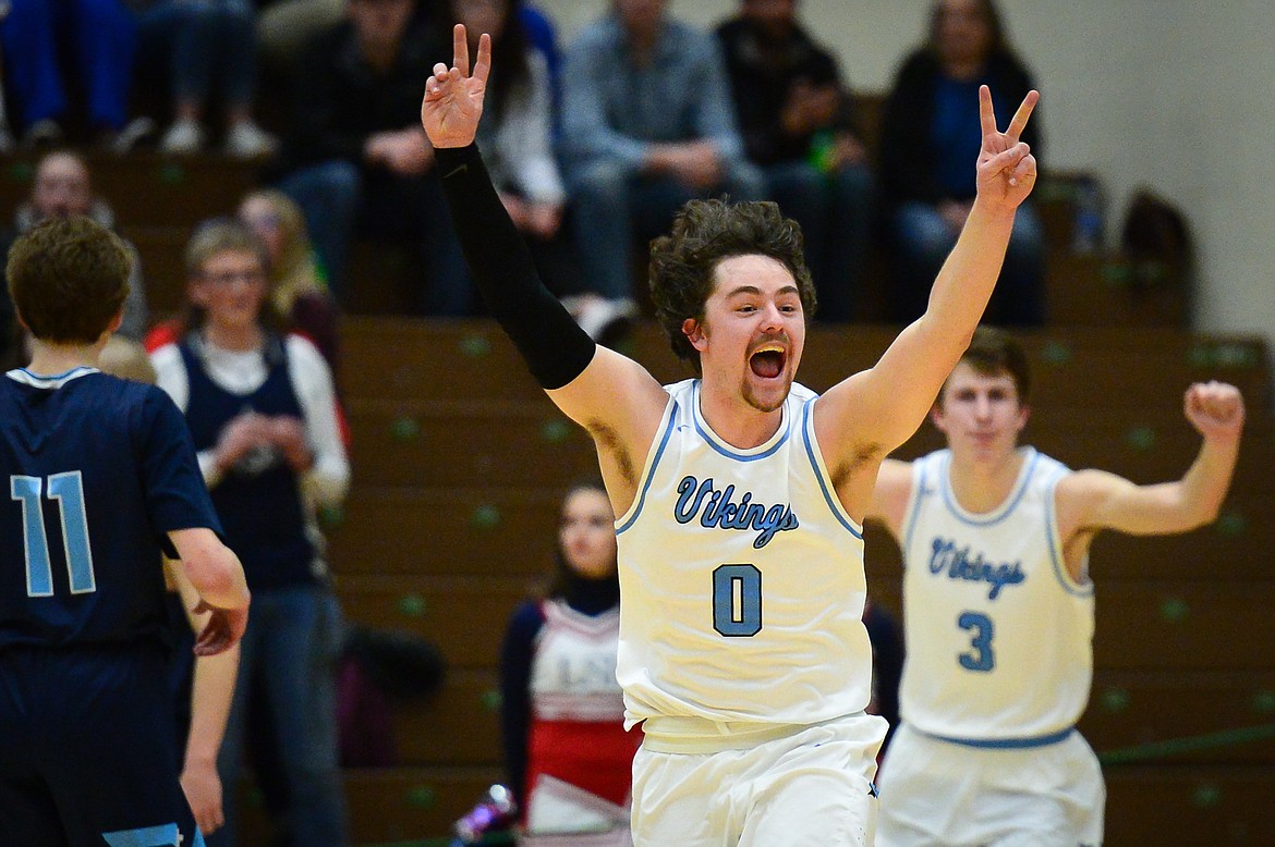 Bigfork&#146;s Anders Epperly (0) and Colton Reichenbach (3) celebrate after the Vikings&#146; 47-43 victory over Loyola Sacred Heart in the State Class B boys&#146; basketball championship at the Belgrade Special Events Center in Belgrade. (Casey Kreider/Daily Inter Lake file)