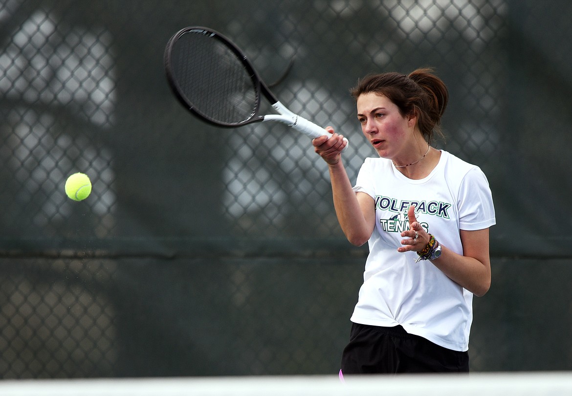 Glacier's Maggie Rudbach hits a return against Flathead's Emma Hawkins during a crosstown tennis match at Flathead Valley Community College on Friday. (Casey Kreider/Daily Inter Lake)