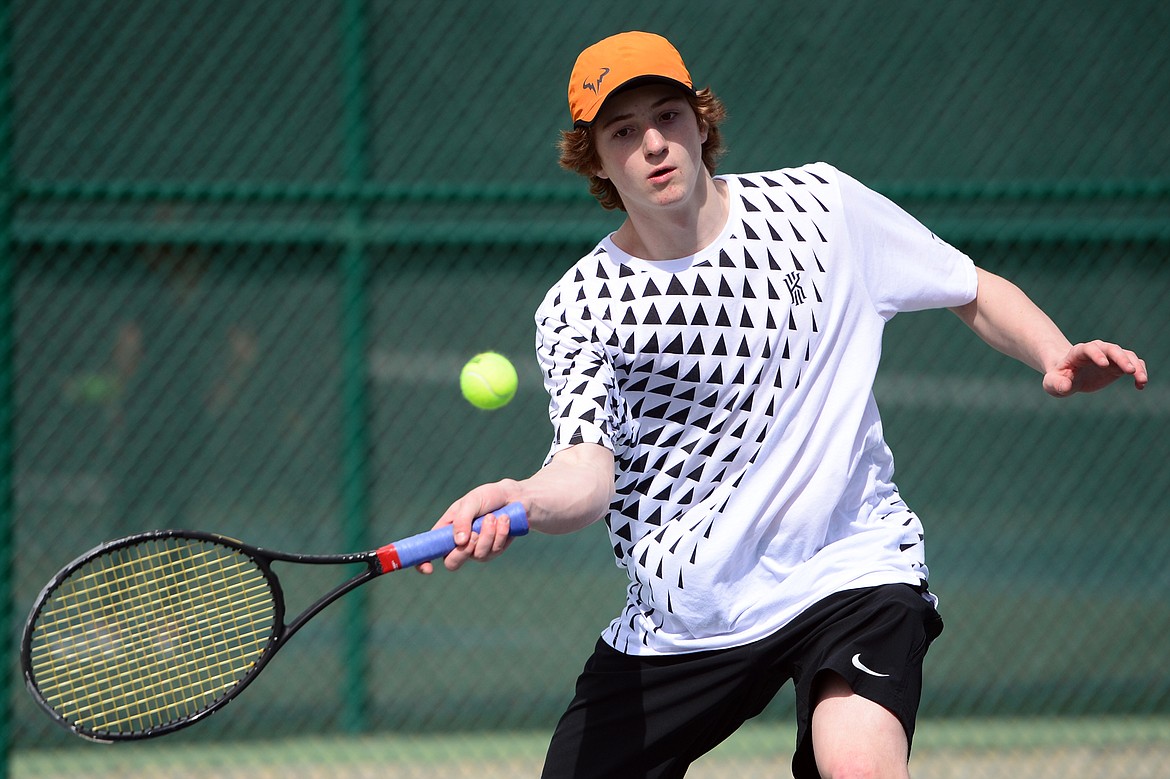 Flathead's Joston Cripe hits a return against Glacier's Kamren Barkus during a crosstown tennis match at Flathead Valley Community College on Friday. (Casey Kreider/Daily Inter Lake)