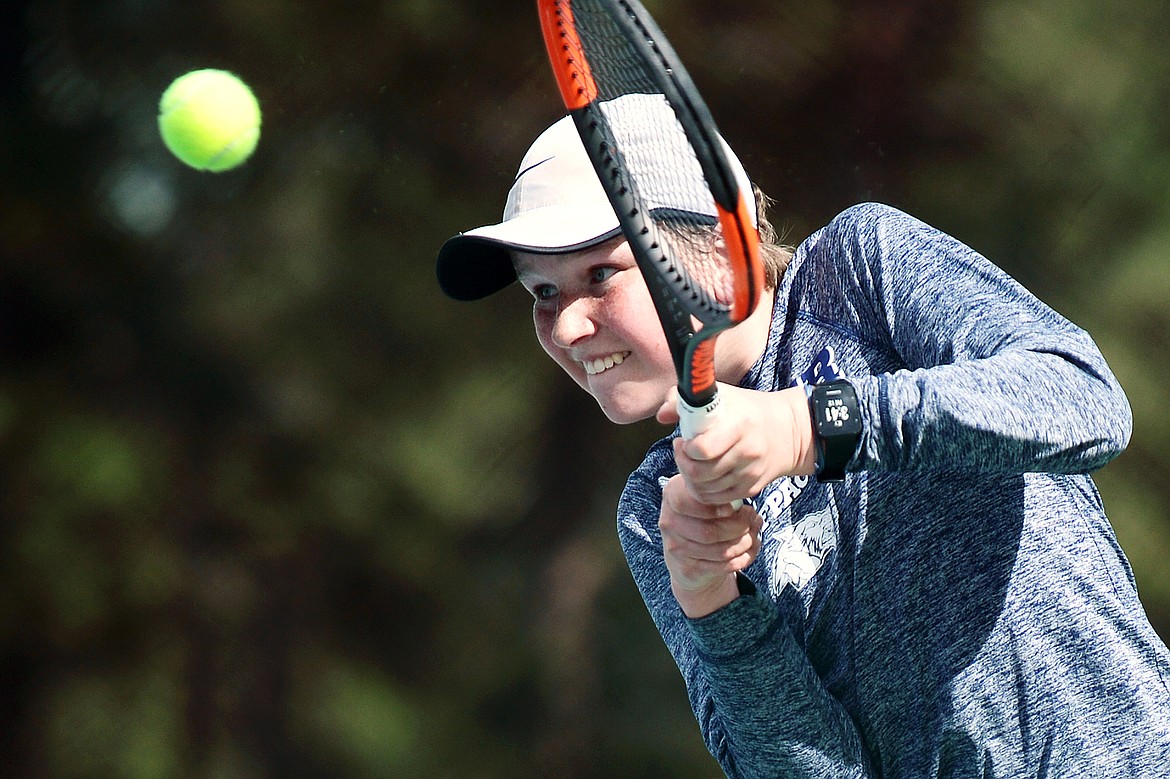 Glacier's Rory Smith hits a return against Flathead's Nolan White during a crosstown tennis match at Flathead Valley Community College on Friday. (Casey Kreider/Daily Inter Lake)