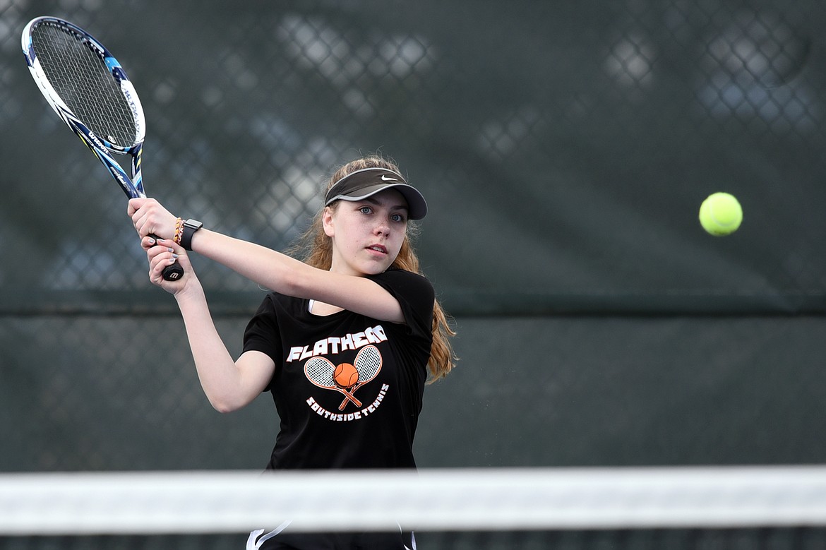 Flathead's Emma Hawkins hits a return against Glacier's Maggie Rudbach during a crosstown tennis match at Flathead Valley Community College on Friday. (Casey Kreider/Daily Inter Lake)