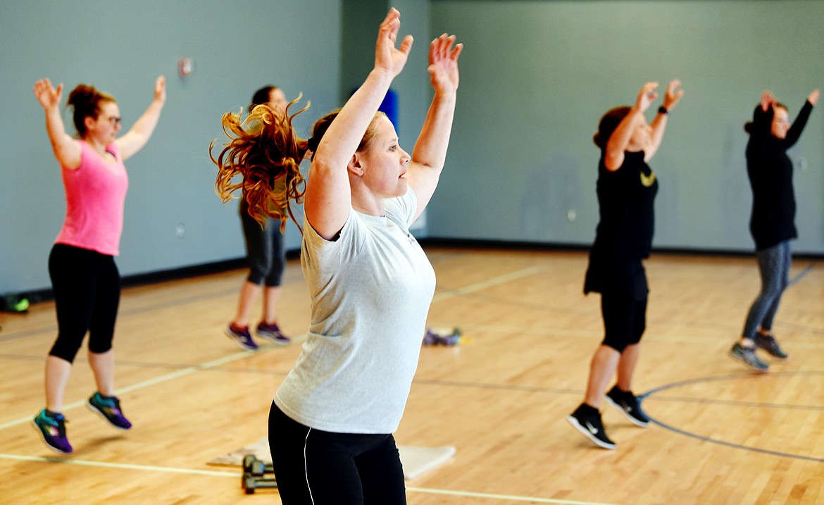 Crystal Thurman and others take part in a weekly exercise program led by physical education teacher Tara Measure at West Valley School.