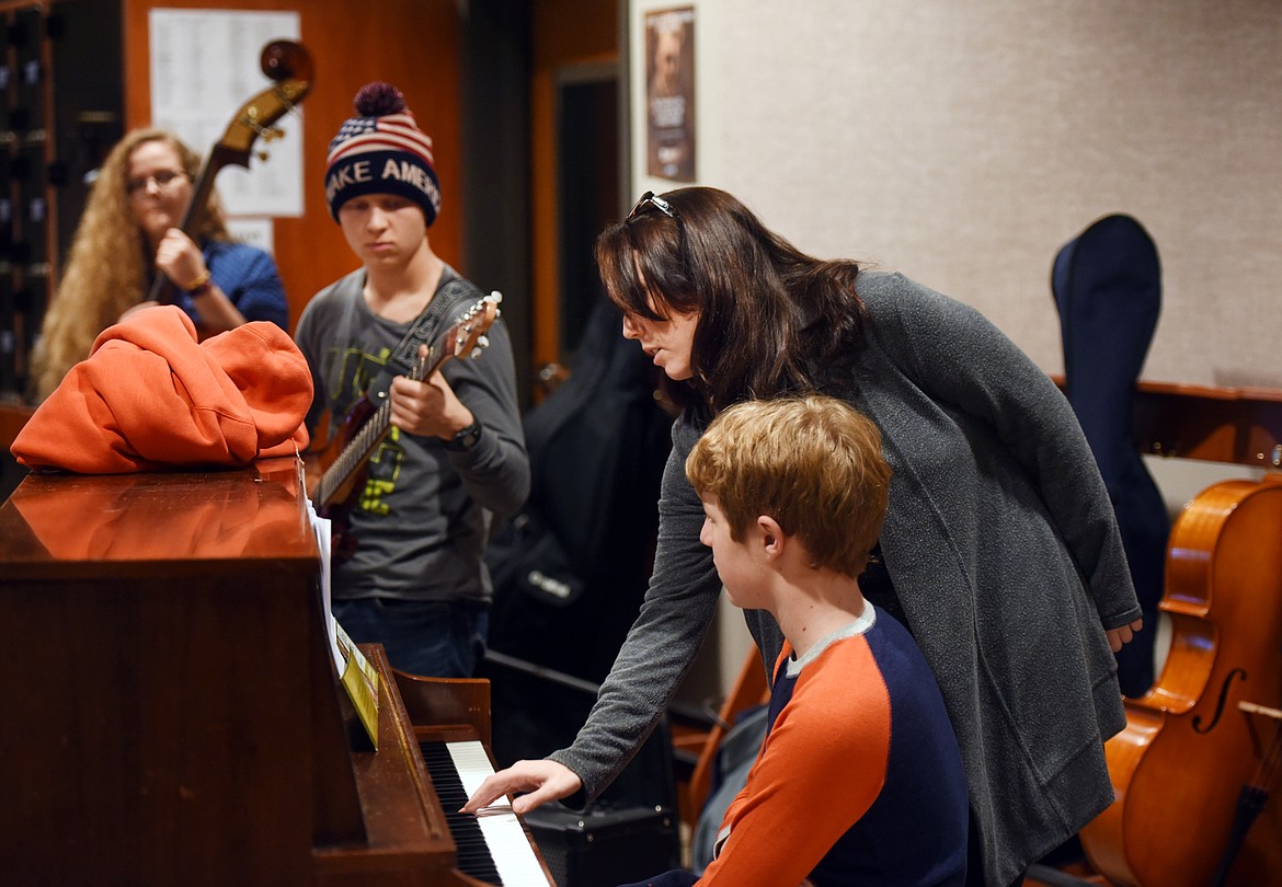 Erica von Kleist helps students in the Flathead Ellington Project during a practice on a Sunday afternoon at Whitefish High School.