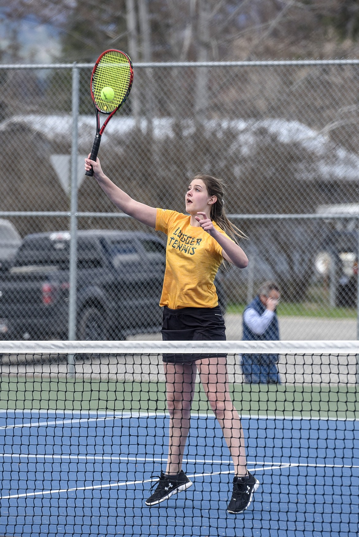Libby sophomore Gabby Fantozzi reaches to make the return during a doubles match against Whitefish Tuesday at Libby. Fantozzi and her partner, sophomore Laneigha Zeiler, were undefeated against both Whitefish and Polson Tuesday. (Ben Kibbey/The Western News)