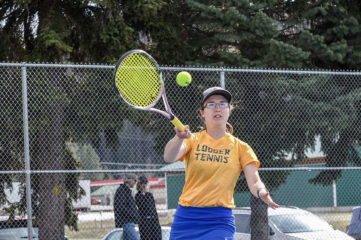 Libby junior Cierra Lucas runs in to make the return against Whitefish Tuesday at Libby. Lucas and sophomore doubles partner Elise Erickson were undefeated Tuesday against both Whitefish and Polson. (Ben Kibbey/The Western News)